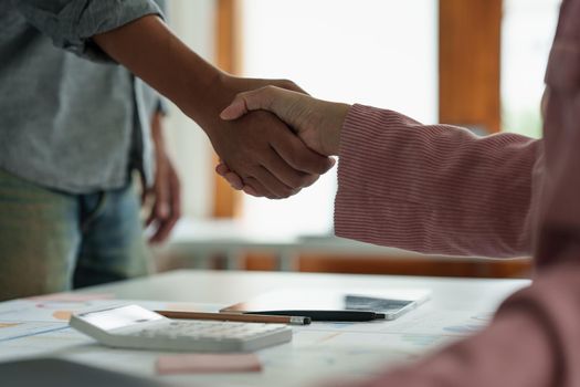 Business partnership meeting concept. Image business woman handshake. Successful business people handshaking after good deal. Group support concept