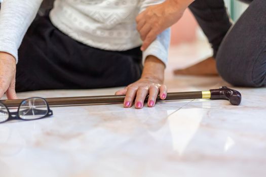 Senior woman falling down at home because stumbled on a door kerb