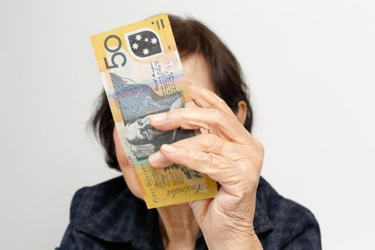 elderly woman has little money