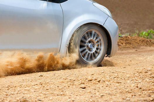 Rally car in dirt track.