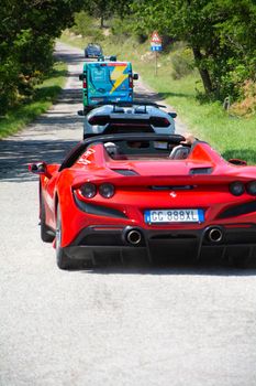 URBINO, ITALY - JUN 16 - 2022 : FERRARI TRIBUTE IN an old racing car in rally Mille Miglia 2022