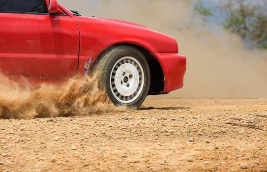 Rally car in dirt track.