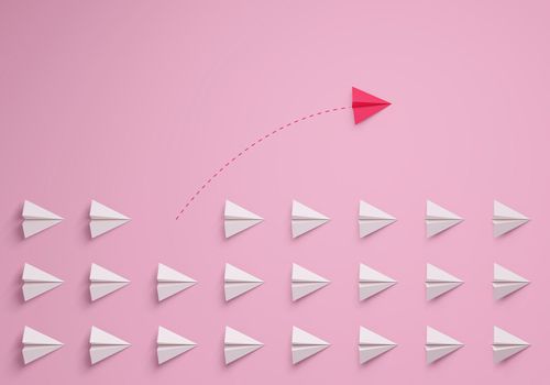 Women's leadership concept. Individual and unique leader pink paper airplane changing direction. 3d rendering.