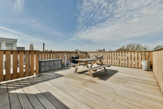 Spacious wooden terrace for eating outdoors