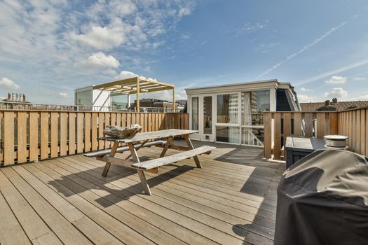 Spacious wooden terrace for eating outdoors