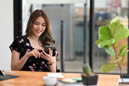 Woman hands holding smart phone with white empty screen for advertise.