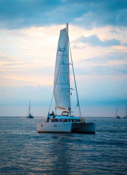 Sailing boat during sunset at Promthep Cape in Phuket peninsula, Thailand. High quality photo