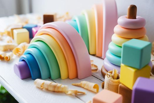 Children's wooden toys. Rainbow made of natural wood painted with water-based paints that are safe for children. Cubes and pyramid. Montessori toys. Eco-friendly, plastic free toys for kids.