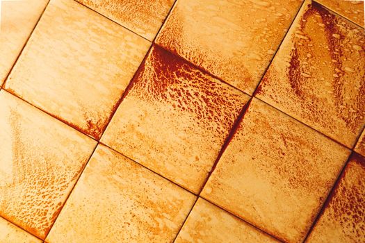 abstract wet rust scattering on a tile background