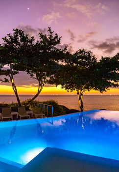 Sunset over pool at Kata beach in Phuket province, in Thailand. High quality photo