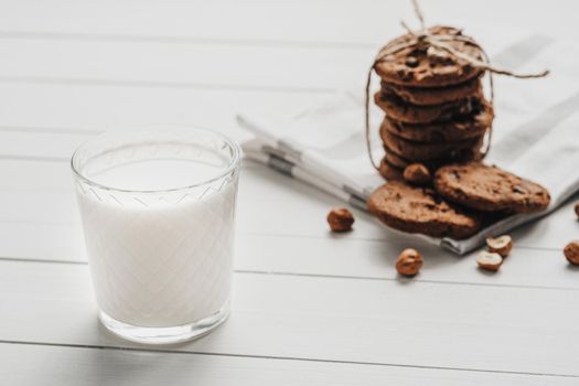 Homemade Cookies and Glass Filled with Milk on White Table