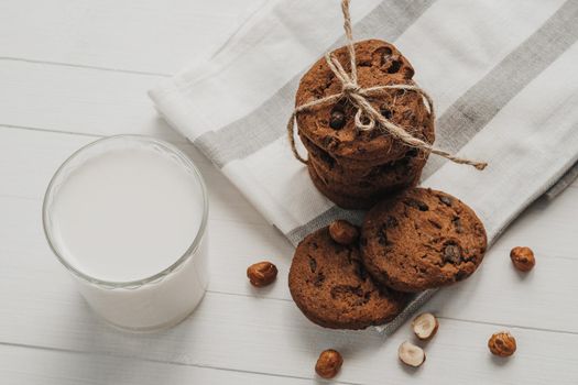 Homemade Cookies and Glass Filled with Milk on White Table