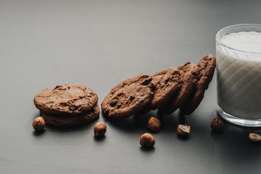 Close Up of Homemade Cookies and Glass Filled with Milk on Table