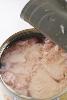 canned tuna on wooden table