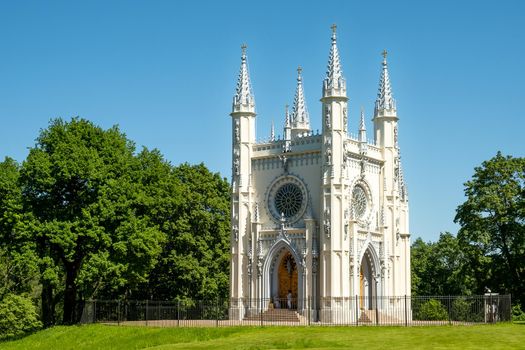 St. Petersburg, Peterhof, Russia - June 25, 2022. Beautiful building of the Gothic chapel in Alexandria park. Historical buildings, architecture. Selective focus.