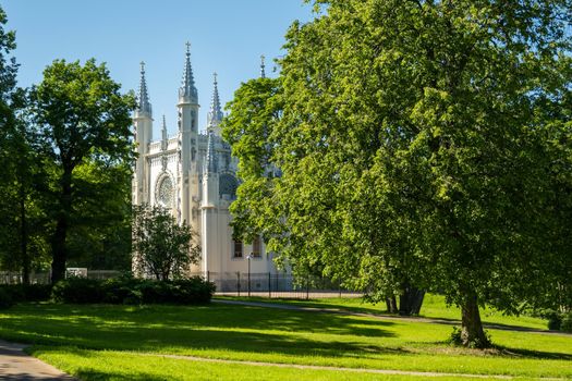 St. Petersburg, Peterhof, Russia - June 25, 2022. Beautiful building of the Gothic chapel in Alexandria park. Historical buildings, architecture. Selective focus.