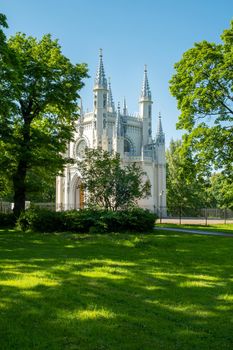 St. Petersburg, Peterhof, Russia - June 25, 2022. Beautiful building of the Gothic chapel in Alexandria park. Historical buildings, architecture. Selective focus.