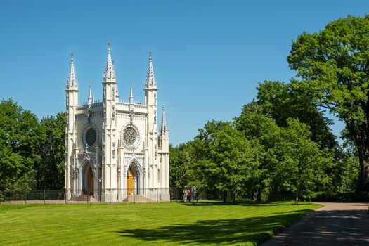 St. Petersburg, Peterhof, Russia - June 25, 2022. Beautiful building of the Gothic chapel in Alexandria park. Historical buildings, architecture. Selective focus.