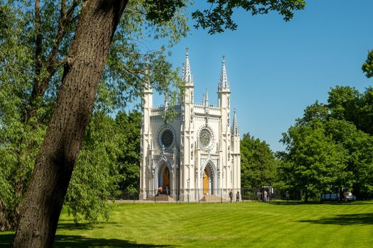 St. Petersburg, Peterhof, Russia - June 25, 2022. Beautiful building of the Gothic chapel in Alexandria park. Historical buildings, architecture. Selective focus.