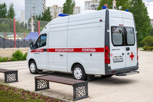 Moscow, Russia - June 17. 2022. An ambulance against the backdrop of residential buildings in Zelenograd