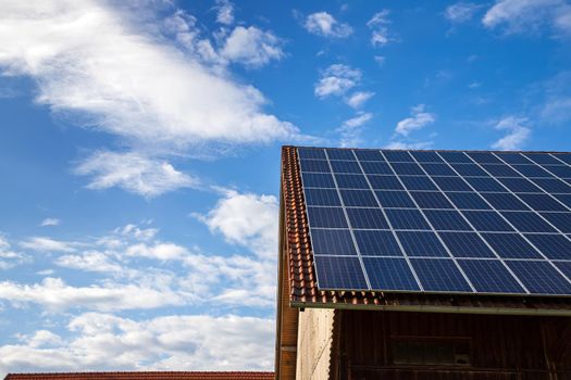 solar panels on the roof of a house. horizontal orientation, blue sky. Energy concept