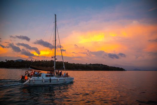 Sailing boat during sunset at Promthep Cape in Phuket peninsula, Thailand. High quality photo