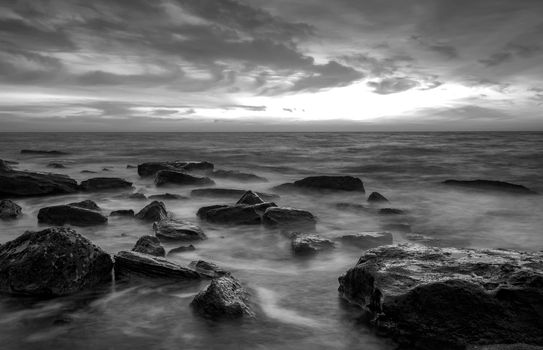 Stunning black and white long exposure seascape at cloudy day.