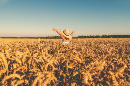 A child in a wheat field. Selective focus. nature.