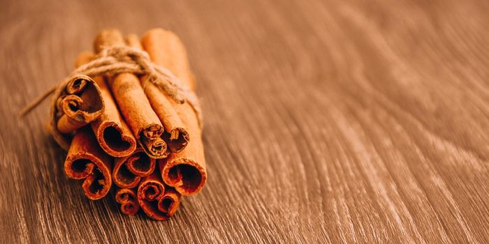 cinnamon sticks on the table, beautiful christmas background with spices, copy space, wood background