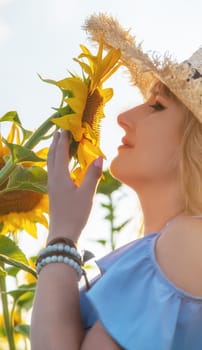 Woman in a field of sunflowers. Selective focus. nature.