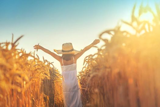 A child in a wheat field. Selective focus. nature.