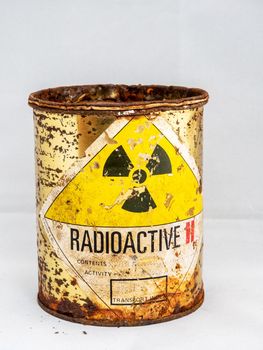 Rusty and decay steel container of old Radioactive material barrel, Radiation garbage emissions, environmental pollution, danger sign