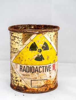 Rusty and decay steel container of old Radioactive material barrel, Radiation garbage emissions, environmental pollution, danger sign