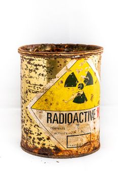 Radiation warning sign on transport index label stick on the old and rusted cylinder shape container of Radioactive material