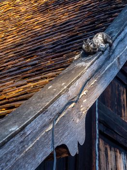 Sculpture of Mom at the roof of temple building in Northern Provinces of Thailand. "Mom" is a Himmapan animal According to the beliefs of the Lanna people