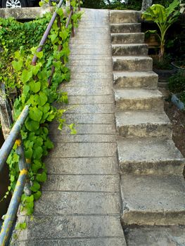 Concrete stairs for pedestrians with concrete ramps for vehicles