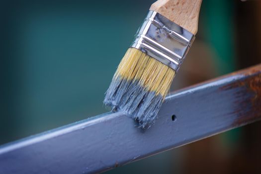 paint the iron frame with gray paint. selective focus