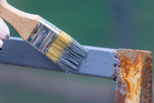 paint the iron frame with gray paint. selective focus