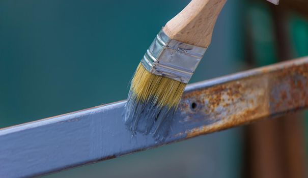 paint the iron frame with gray paint. selective focus