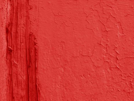 An old red wall with smudges. Abstract background of worn plaster.