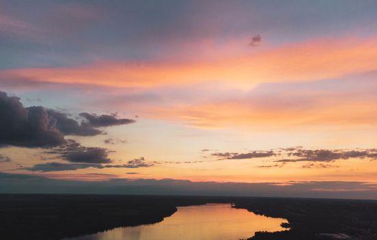 River water in beautiful sunset with clouds, landscape view