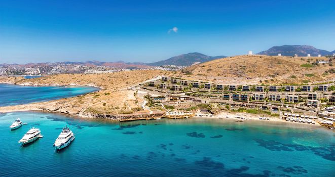 Beautiful landscape with sea view and luxury yacht in the sea. Modern architecture on Greece island, Greece. Traveling concept background, Impressive day aerial  view island. Greece Luxury travel