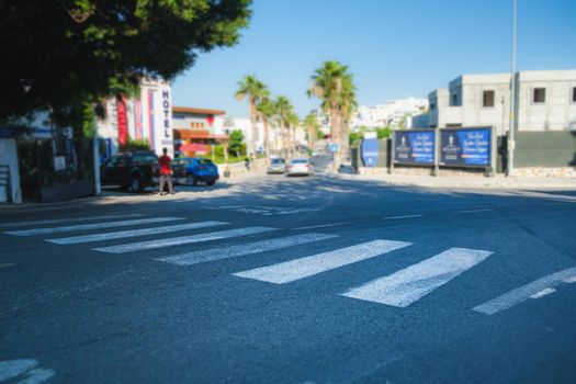 crosswalk on the road. crosswalk on the road for safety when people walking cross the street. crossing a crosswalk.