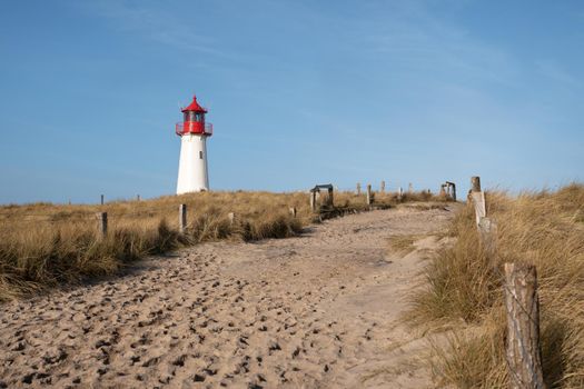 Panoramic image of List West lighthouse against blue sky, Sylt, North Frisia, Germany 