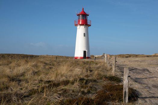 Panoramic image of List West lighthouse against blue sky, Sylt, North Frisia, Germany 