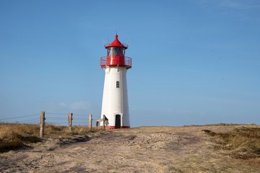 Panoramic image of List West lighthouse against blue sky, Sylt, North Frisia, Germany 