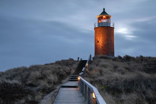 Panoramic image of Kampen lighthouse against evening sky, Sylt, North Frisia, Germany 