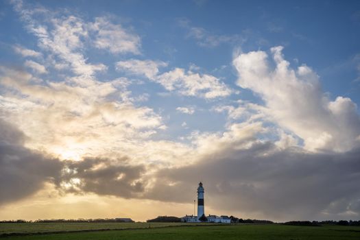 Panoramic image of Kampen lighthouse against dramatic sky, Sylt, North Frisia, Germany 