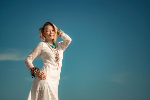 fashionable young model in boho style dress