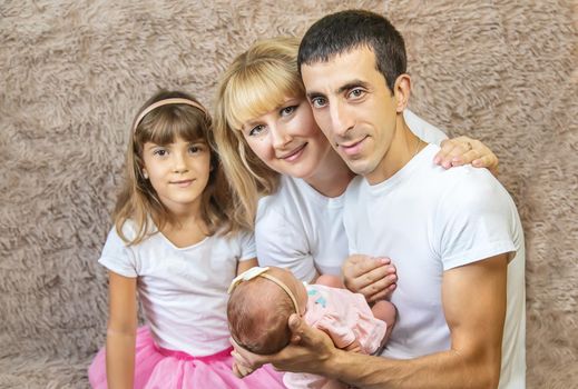 family photo with a newborn. selective focus. people.